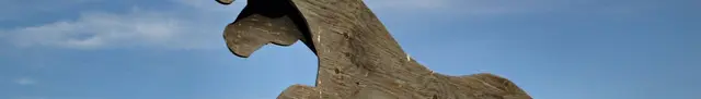 Plywood horse cutout against the sky